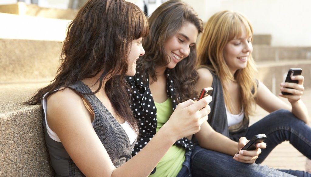 Teen girls with mobile phones